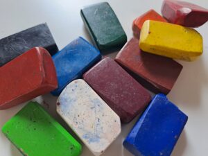 Coloured crayons laying around messily